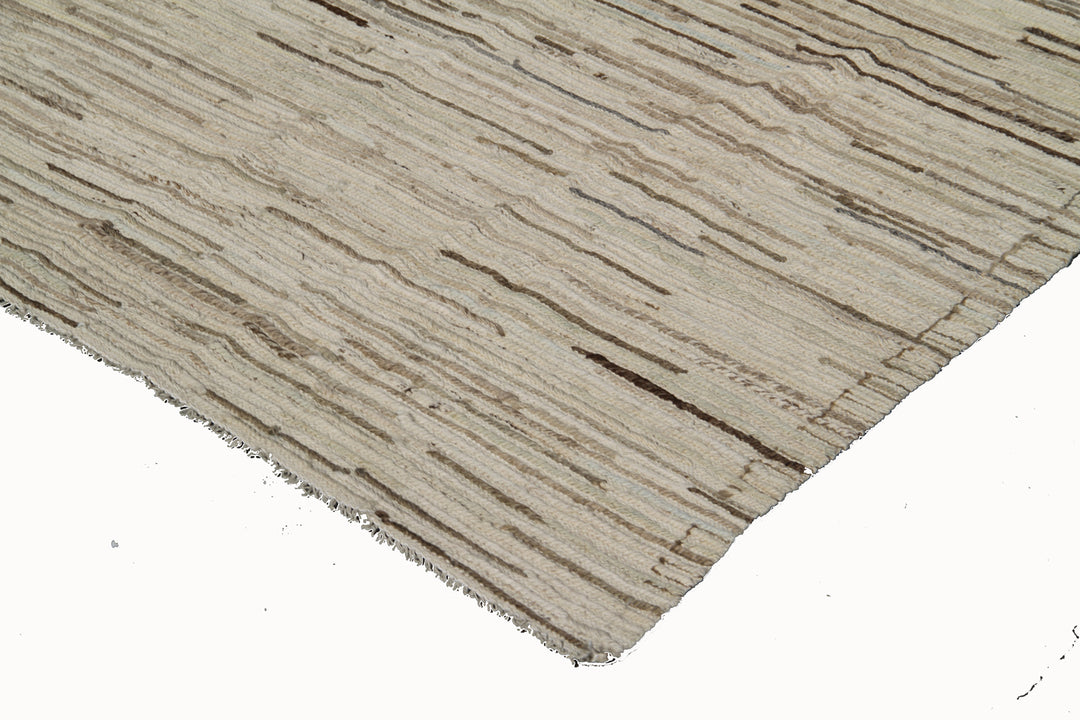 Ariana Rugs 7'x10' handwoven soft brown Gabbeh style Barchi wool area rug featuring a subtle striped motif on an all-wool foundation.
