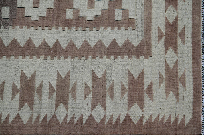 Ariana Rugs 8'x9' handwoven earth tone brown and tan Maimana style wool kilim area rug featuring a classic geometric pattern on a cotton foundation.