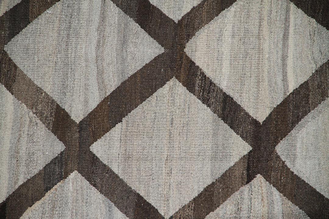 Ariana Rugs 9'x12' handwoven brown and ivory wool kilim area rug featuring a modern flatweave construction on a cotton foundation.