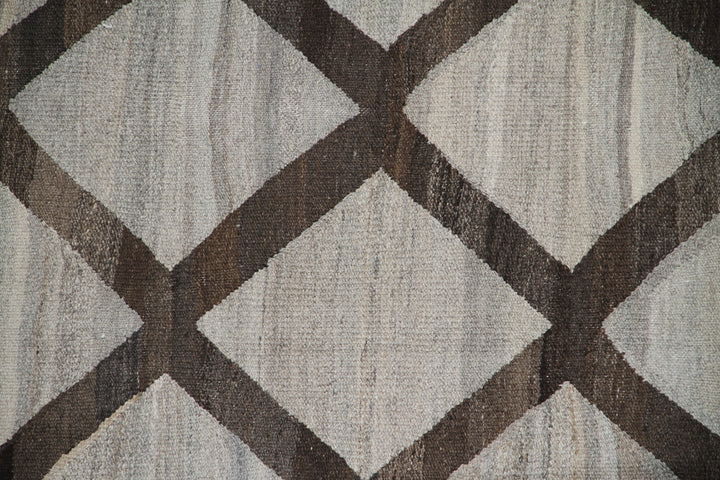 Ariana Rugs 9'x12' handwoven brown and ivory wool kilim area rug featuring a modern flatweave construction on a cotton foundation.