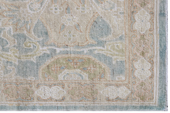 Fine hand-knotted Ariana traditional Agra design wool runner rug with classic floral scrollwork in soft blue, beige, and cream