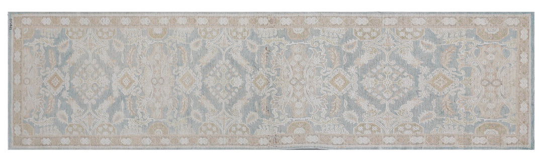 Fine hand-knotted Ariana traditional Agra design wool runner rug with classic floral scrollwork in soft blue, beige, and cream