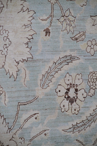 Authentic Ariana Traditional Collection 9x12 wool area rug featuring a classical Sultanabad design on a deep blue background field, hand-knotted in Afghanistan.