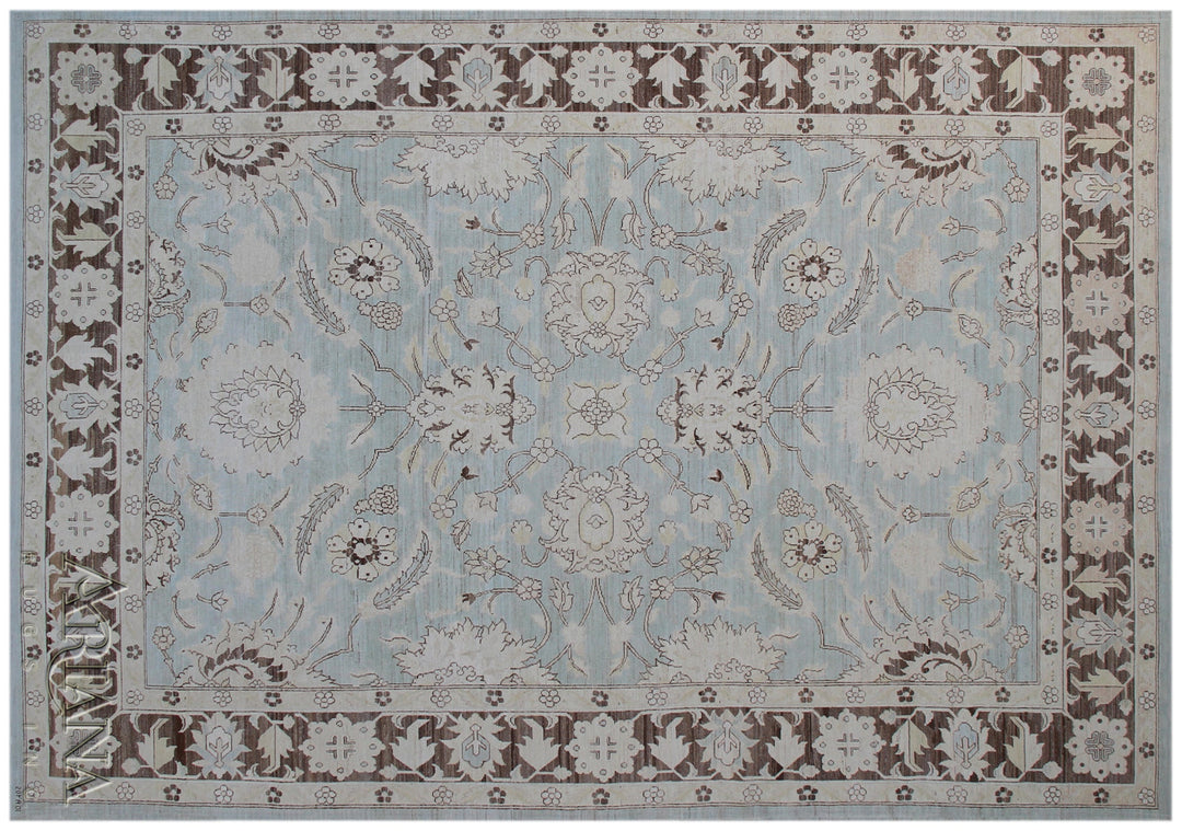 Authentic Ariana Traditional Collection 9x12 wool area rug featuring a classical Sultanabad design on a deep blue background field, hand-knotted in Afghanistan.