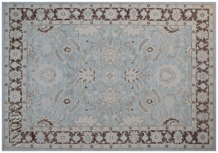 Authentic Ariana Traditional Collection 9x12 wool area rug featuring a classical Sultanabad design on a deep blue background field, hand-knotted in Afghanistan.