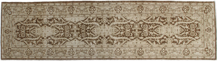 A rectangular traditional Tabriz design rug with brown ivory coloring and intricate geometric patterns.