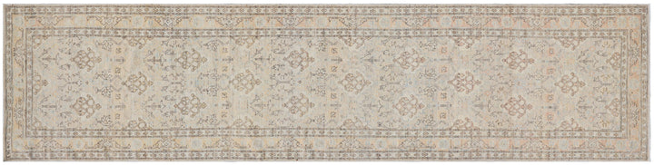 Fine hand-knotted Ariana transitional European design wool runner rug in rich camel, blue, brown, and terracotta tones