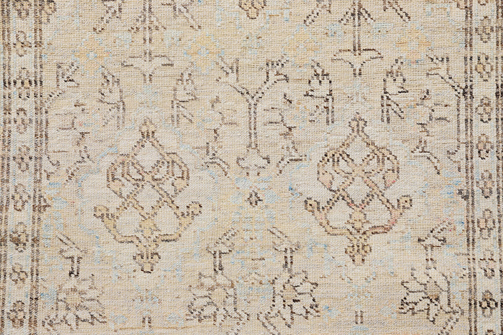 Fine hand-knotted Ariana transitional European design wool runner rug in rich camel, blue, brown, and terracotta tones