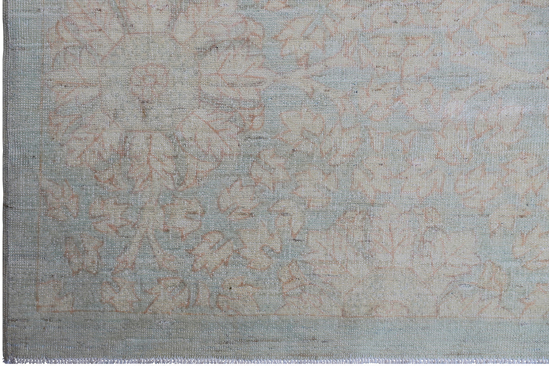 Hand-knotted 9x12 Ariana Vintage wool rug with European design patterns in soft turquoise and ivory