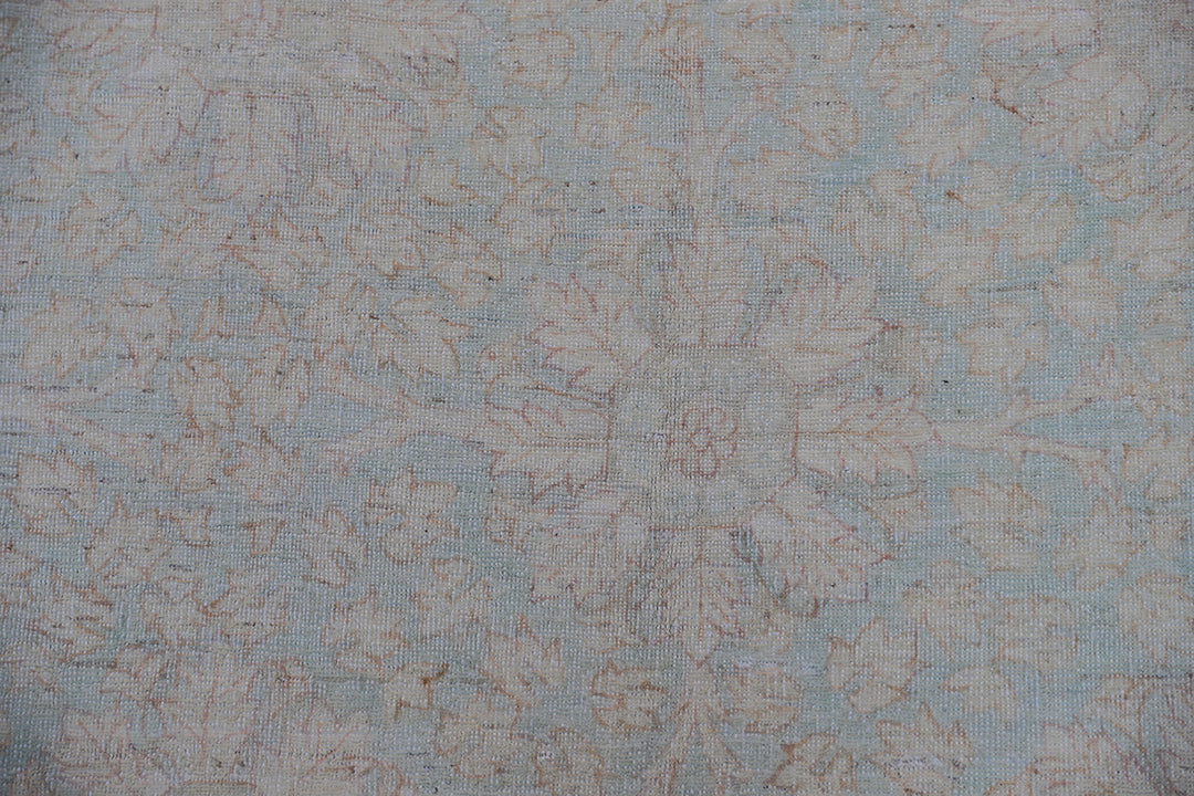 Hand-knotted 9x12 Ariana Vintage wool rug with European design patterns in soft turquoise and ivory