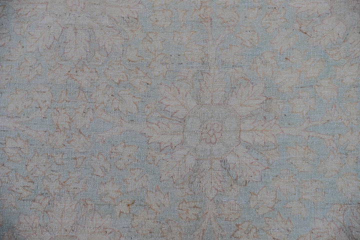 Hand-knotted 9x12 Ariana Vintage wool rug with European design patterns in soft turquoise and ivory
