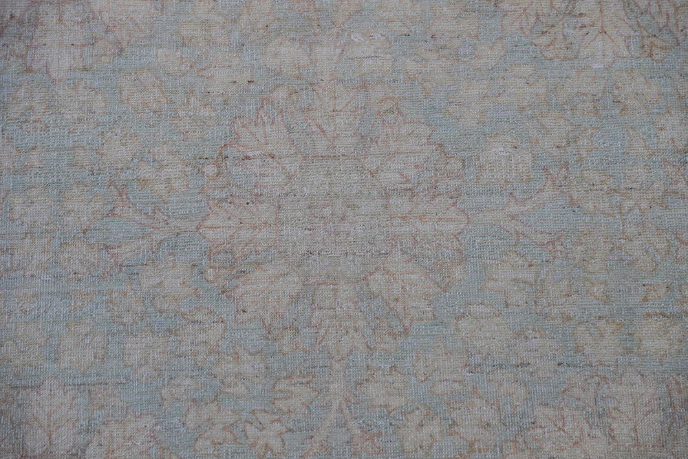 Hand-knotted 9x12 Ariana Vintage wool rug with European design patterns in soft turquoise and ivory-