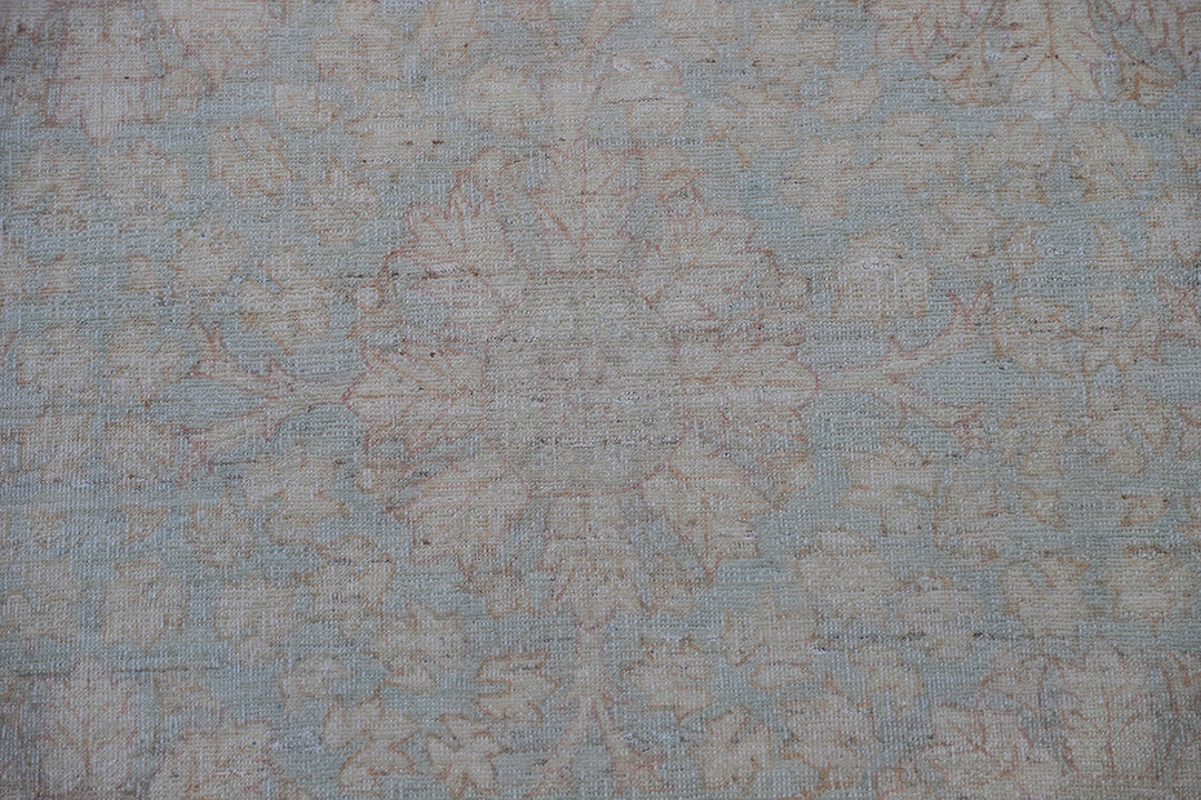 Hand-knotted 9x12 Ariana Vintage wool rug with European design patterns in soft turquoise and ivory-