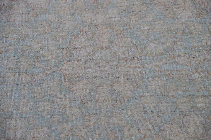 Hand-knotted 9x12 Ariana Vintage wool rug with European design patterns in soft turquoise and ivory-