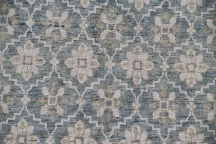 Authentic hand-knotted Afghan area rug from the Ariana Samarkand Collection, featuring a classic geometric design in blue and ivory organic wool.