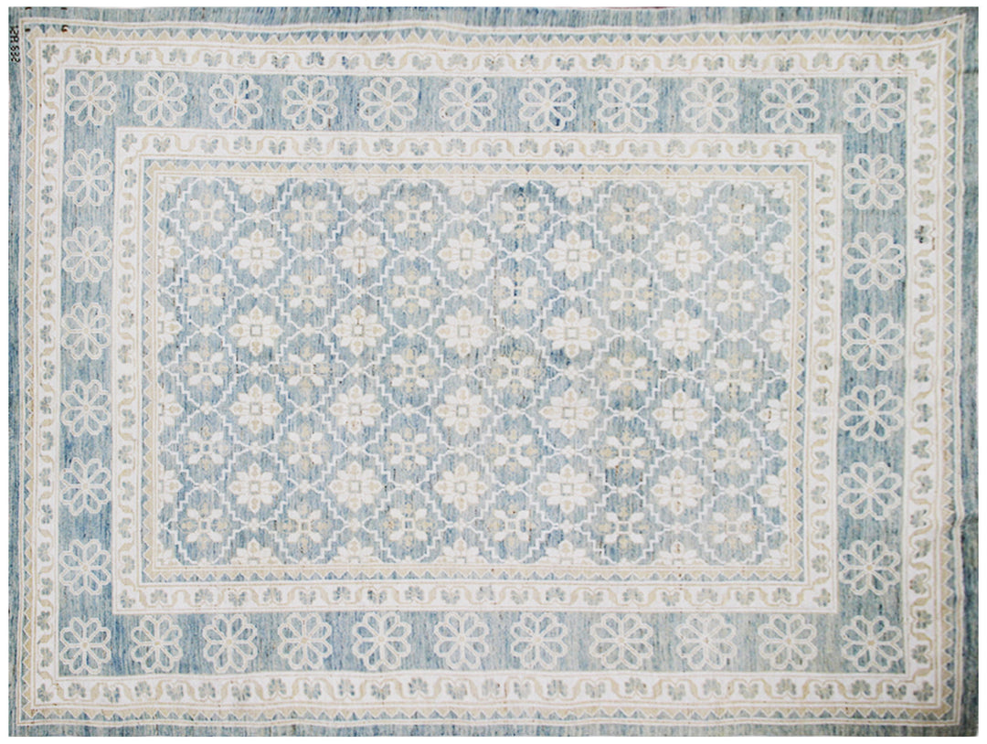 Authentic hand-knotted Afghan area rug from the Ariana Samarkand Collection, featuring a classic geometric design in blue and ivory organic wool.