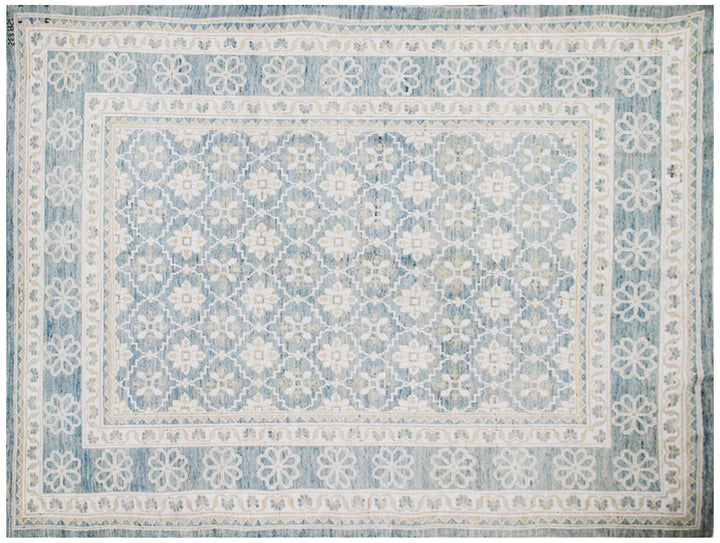 Authentic hand-knotted Afghan area rug from the Ariana Samarkand Collection, featuring a classic geometric design in blue and ivory organic wool.