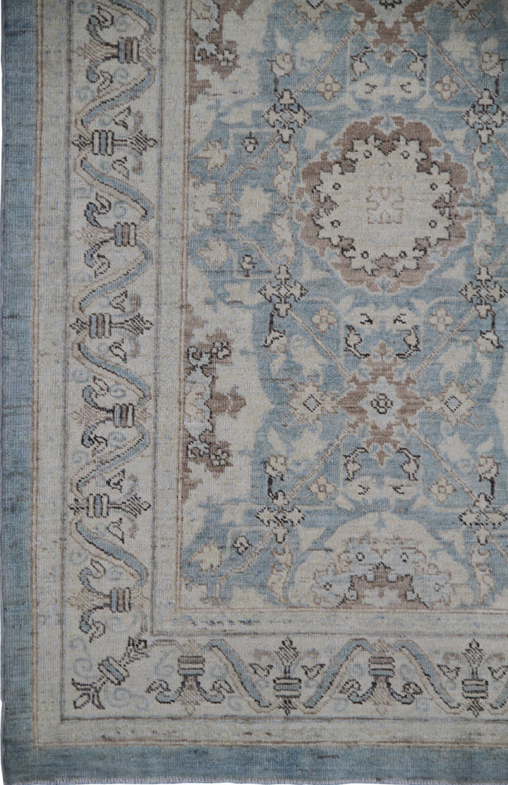 Authentic fine hand-knotted Afghan runner rug from the Ariana Traditional Collection, featuring the Agra 505 Blue design in low-pile blue, ivory, and brown organic wool.