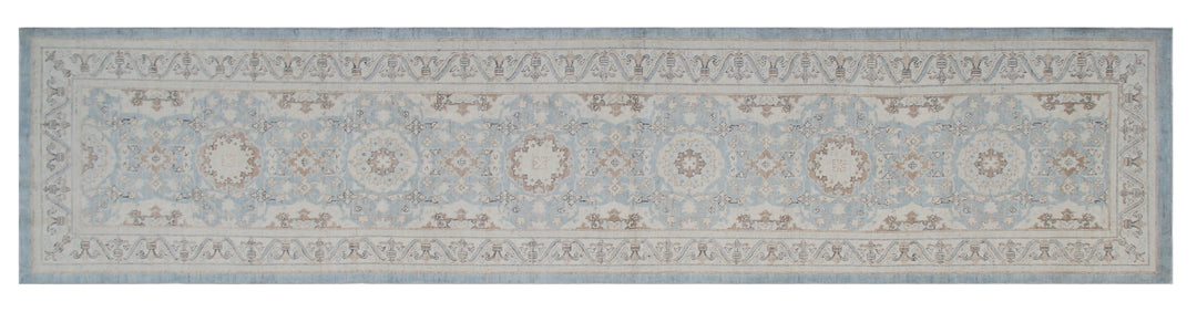 Authentic fine hand-knotted Afghan runner rug from the Ariana Traditional Collection, featuring the Agra 505 Blue design in low-pile blue, ivory, and brown organic wool.