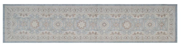 Authentic fine hand-knotted Afghan runner rug from the Ariana Traditional Collection, featuring the Agra 505 Blue design in low-pile blue, ivory, and brown organic wool.