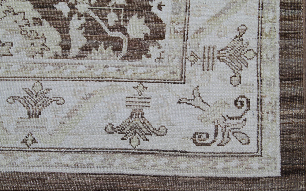 Authentic fine hand-knotted Afghan area rug from the Ariana Traditional Collection, featuring the Agra 505 brown design in low-pile warm brown and ivory organic wool.