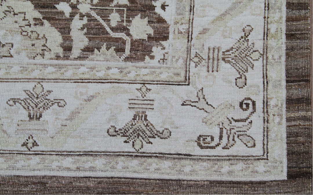 Authentic fine hand-knotted Afghan area rug from the Ariana Traditional Collection, featuring the Agra 505 brown design in low-pile warm brown and ivory organic wool.