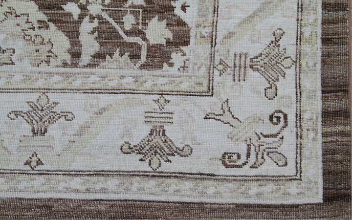Authentic fine hand-knotted Afghan area rug from the Ariana Traditional Collection, featuring the Agra 505 brown design in low-pile warm brown and ivory organic wool.