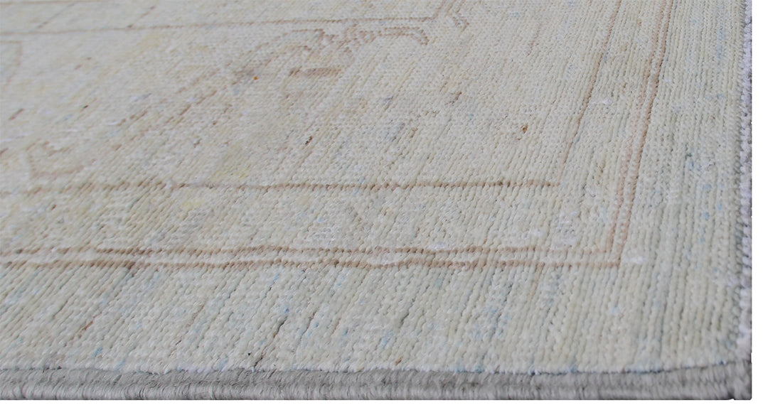Authentic hand-knotted Afghan runner rug from the Ariana Transitional Collection, featuring the Agra 505 design in low-pile soft blue organic wool.