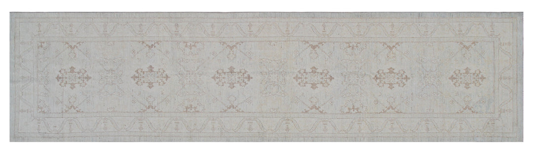 Authentic hand-knotted Afghan runner rug from the Ariana Transitional Collection, featuring the Agra 505 design in low-pile soft blue organic wool.