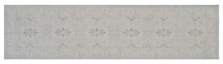 Authentic hand-knotted Afghan runner rug from the Ariana Transitional Collection, featuring the Agra 505 design in low-pile soft blue organic wool.