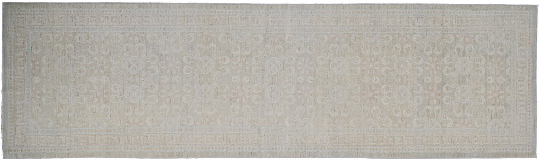 Authentic hand-knotted Afghan runner rug from the Ariana Transitional Collection, featuring a vintage floral design in washed-out olive green organic wool.