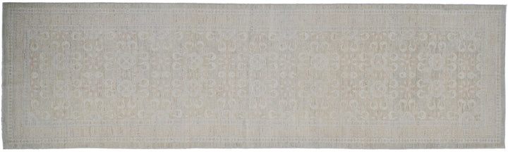 Authentic hand-knotted Afghan runner rug from the Ariana Transitional Collection, featuring a vintage floral design in washed-out olive green organic wool.