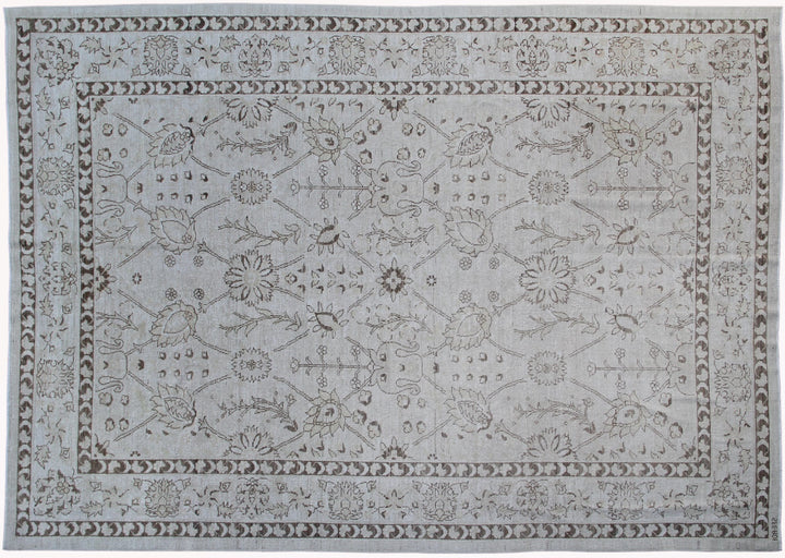 Authentic hand-knotted Afghan area rug from the Ariana Transitional Collection, featuring a classic Tabriz floral design in a low-pile ivory and brown organic wool weave.