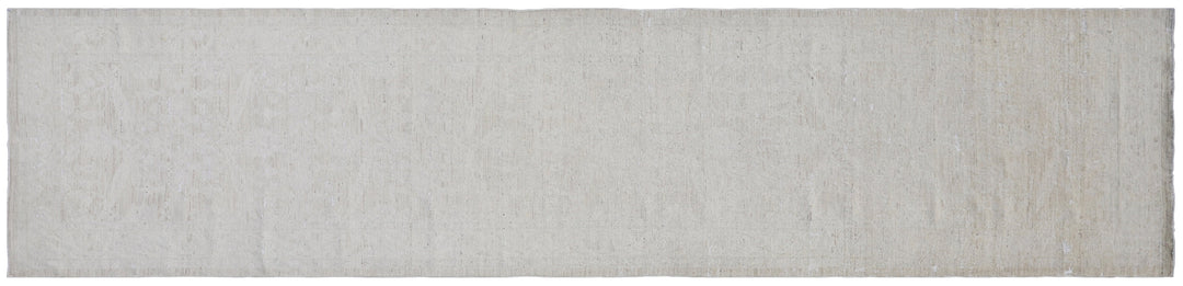 Authentic hand-knotted Afghan runner rug from the Ariana Vintage Collection, featuring a brand-new, beautifully distressed geometric design in pale, muted organic wool tones.