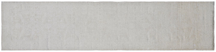 Authentic hand-knotted Afghan runner rug from the Ariana Vintage Collection, featuring a brand-new, beautifully distressed geometric design in pale, muted organic wool tones.