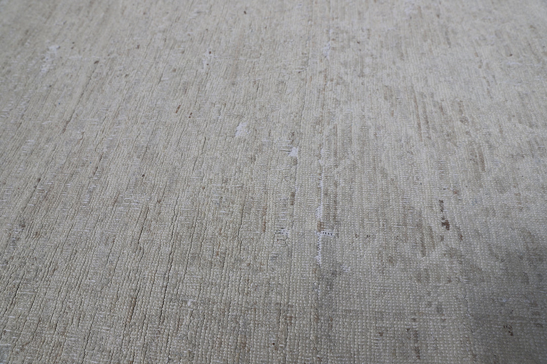 Authentic hand-knotted Afghan runner rug from the Ariana Vintage Collection, featuring a brand-new, beautifully distressed geometric design in pale, muted organic wool tones.