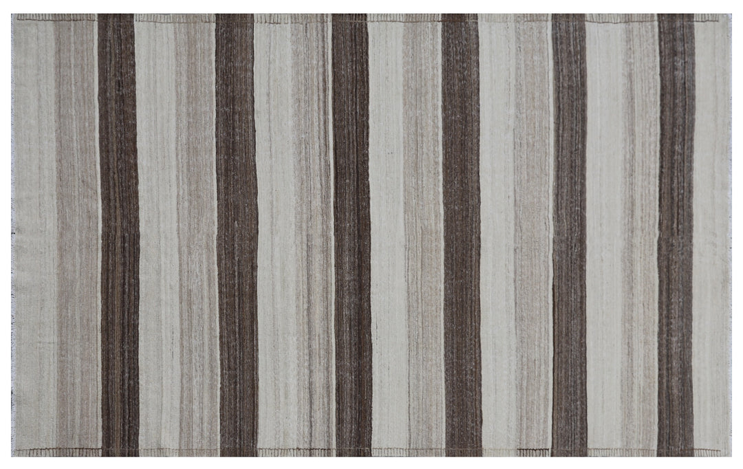 Contemporary living room styled with a 6x9 taupe, brown, and cream striped Afghan wool kilim from Ariana Rugs West Hollywood.