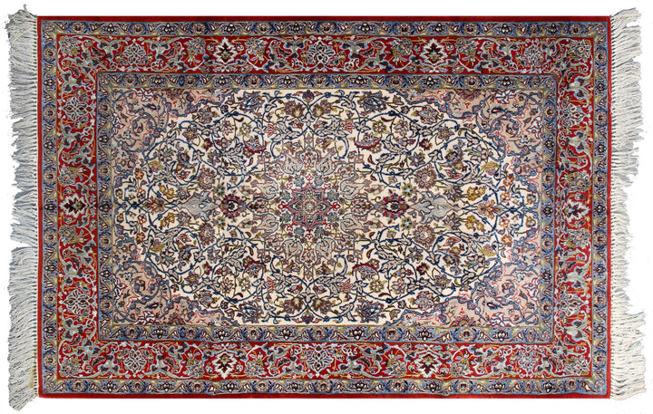 A traditional oriental area rug with an intricate floral and medallion pattern, featuring a red border, cream center, and white fringe on the top and bottom.