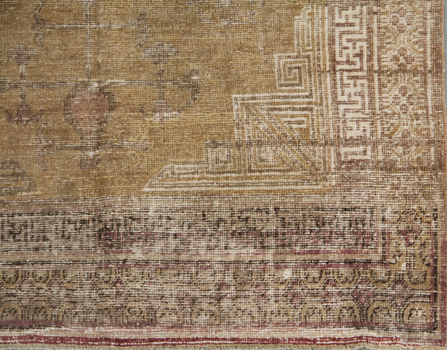 Vintage antique Samarkand Khotan hand-knotted wool runner measuring 8'9" x 4'7" featuring a luminous gold, white, and brown color palette.