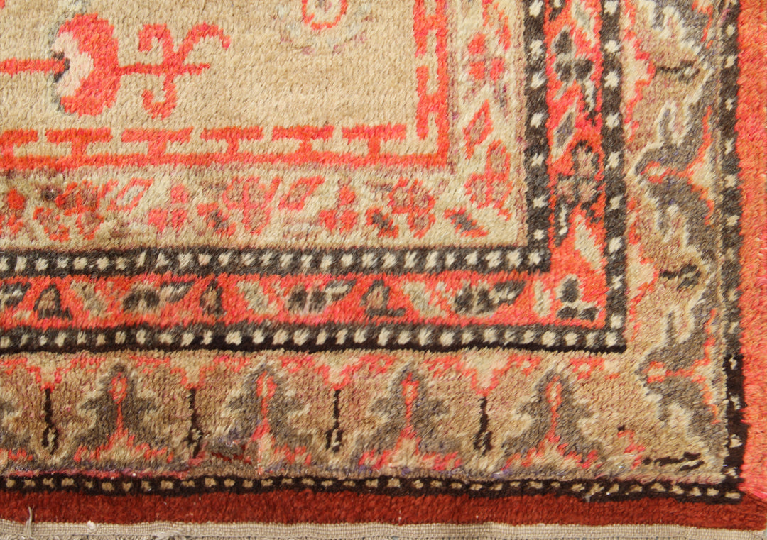 Antique Samarkand Khotan hand-knotted wool rug measuring 9'0" x 5'0" featuring a geometric medallion design in gold, yellow, pink, red, and brown.
