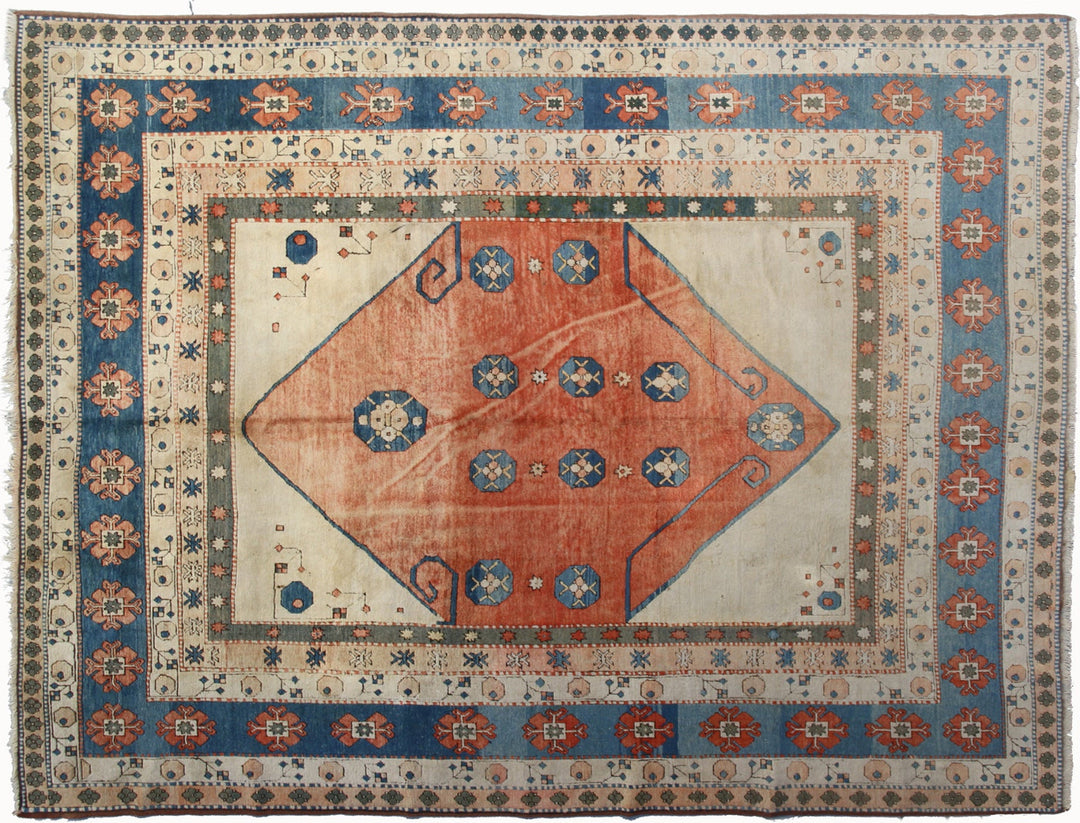 10x12- vintage hand-knotted Turkish wool area rug showing natural wear and subtle patina