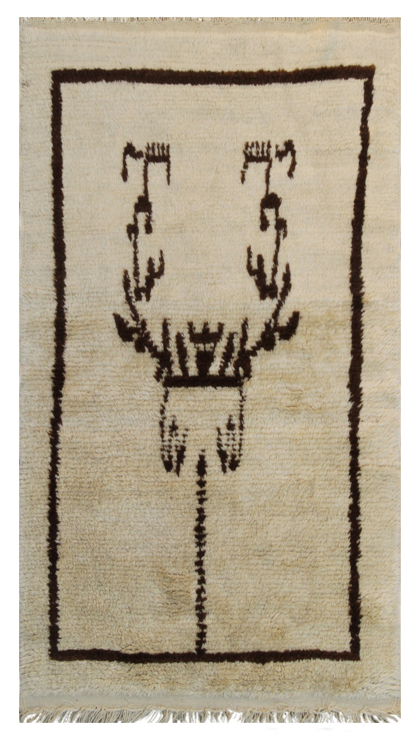 A small 3x5 vintage Turkish Tulu rug with a shaggy ivory wool pile and a minimalist brown tribal geometric design.