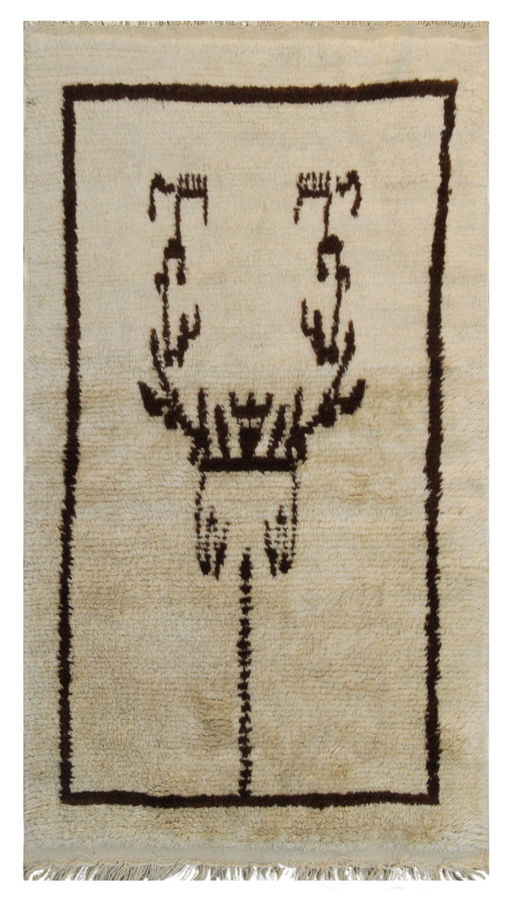 A small 3x5 vintage Turkish Tulu rug with a shaggy ivory wool pile and a minimalist brown tribal geometric design.