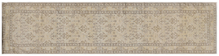 Fine hand-knotted Ariana transitional European design wool runner rug in rich camel, blue, brown, and terracotta tones