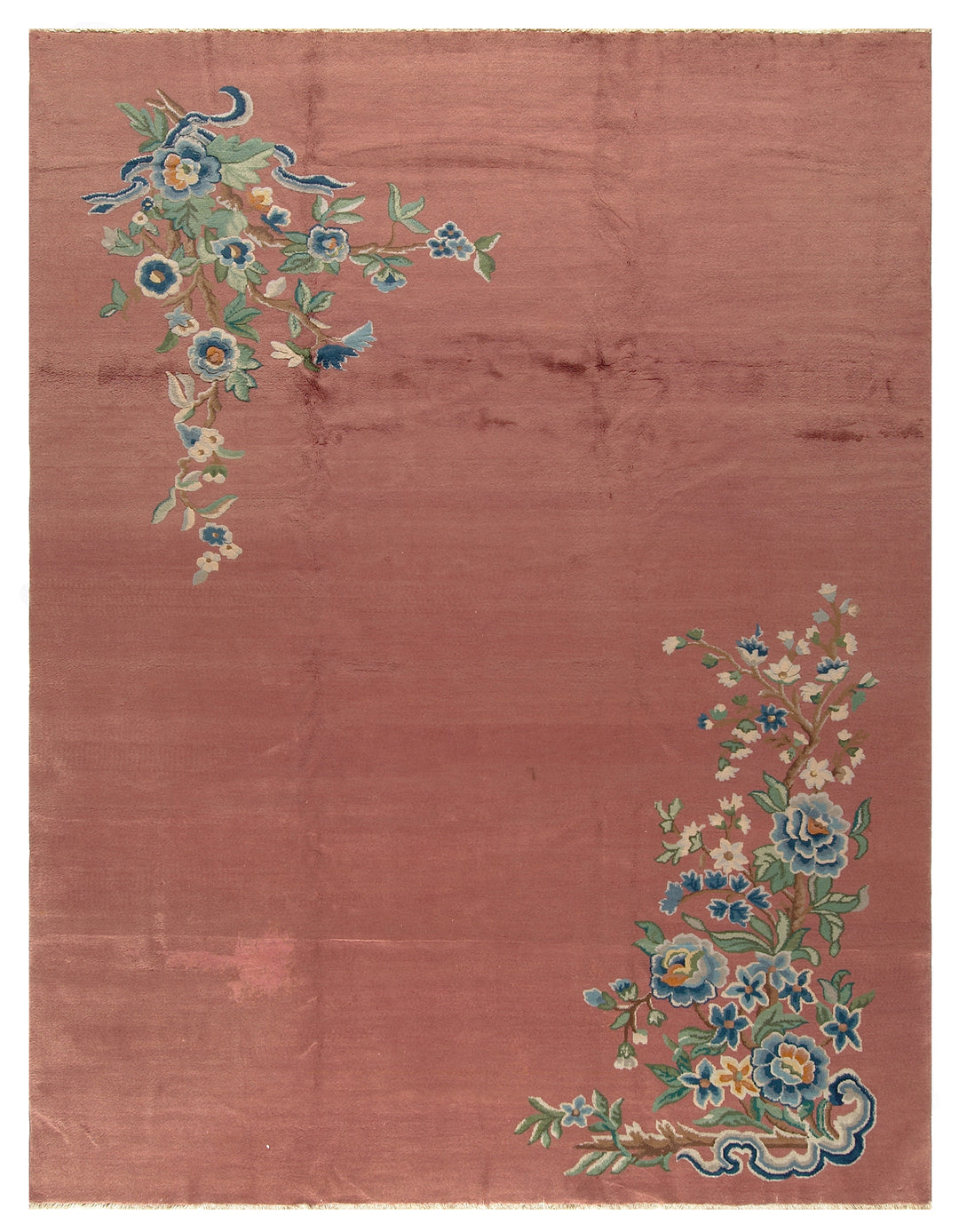 A 9x11 vintage Chinese Art Deco wool rug with a soft salmon pink background and sage green floral accents in the corners.